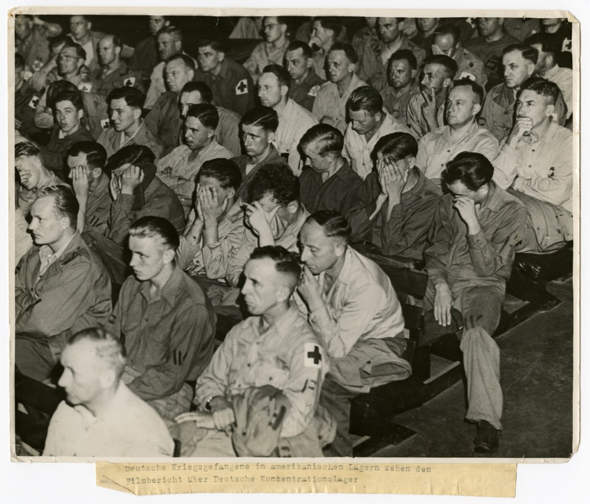 German prisoners of war in an American camp viewing footage of concentration camps in 1945